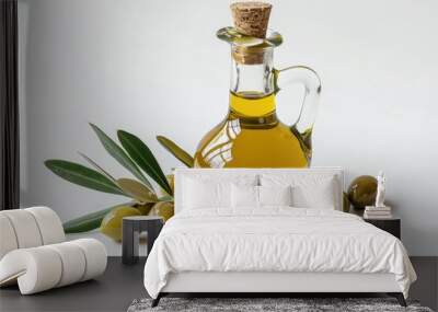 A bottle of olive oil alongside some green olives, perfect for cooking and adding flavor to your dishes Wall mural