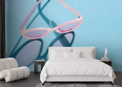 Pink plastic sunglasses. Wall mural