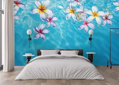 Transparent tropical water texture surface with tropical plumeria flowers. Concept for travel. Copy space.. Wall mural