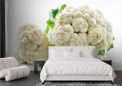 Two fresh cauliflower heads on a clean white surface Wall mural