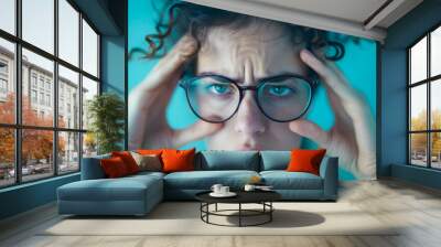 Woman Concentrating with Glasses Wall mural