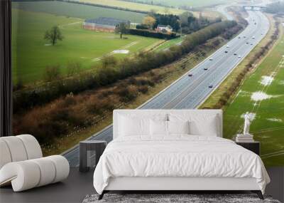 Aerial view of the M11 motorway running through the farmland of Cambridgeshire Wall mural