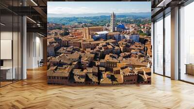 Aerial view of the terracotta rooftops of the UNESCO world heritage city of Siena with Siena Cathedral Wall mural