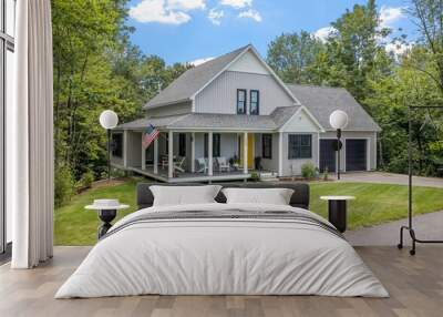 Modern custom new England colonial home with an American flag on a sunny day Wall mural