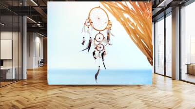 Dream catcher blown around by a light sea breeze Wall mural