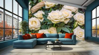 Basket with soft cream and white roses Wall mural