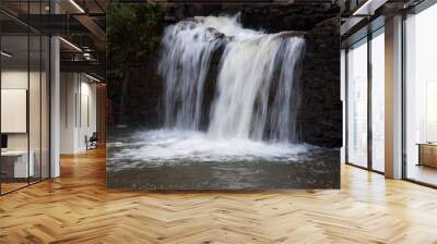 mountain water cascading by rocks Wall mural