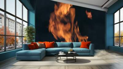 Orange flame on black background Wall mural