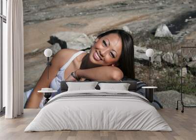 Woman resting on a backpack Wall mural