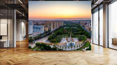 Aerial drone view of sunrise over Turia Gardens, a riverbed turned into a park, in Valencia, Spain Wall mural