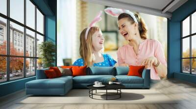 cheerful young mother and child having fun time Wall mural