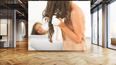 Closeup on happy young woman wiping hair with towel Wall mural