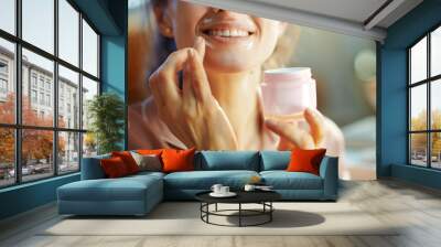 happy elegant woman with jar applying lip contour cream Wall mural