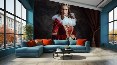 medieval queen in red dress with white collar and crown Wall mural