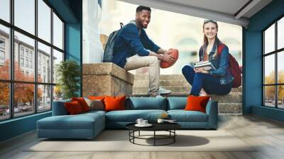 Education, campus friends and diversity students relax before college lecture class, learning or study course. University, knowledge and school portrait of woman and black man on football scholarship Wall mural