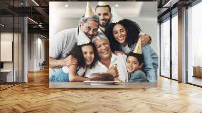 Family, portrait and happy birthday celebration with a hug for senior woman with a cake, love and care. Children, parents and grandparents together for party to celebrate excited grandma with dessert Wall mural