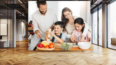 Healthy food, cooking and bonding of family making, preparing and cutting ingredients for meal together in a home kitchen. Happy parents teaching fun kids about fresh, homemade and nutritious eating Wall mural