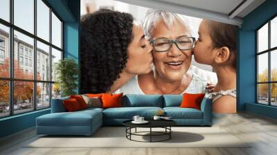 Kiss, affection and children with grandmother for love, birthday or mothers day. Gratitude, care and an elderly woman with a baby and daughter kissing for appreciation, caring and loving at home Wall mural