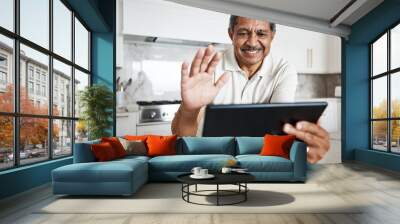 Man, tablet and wave on video call in home for virtual communication, connection and social network. Happy mature guy with digital technology, hello and voip online with smile, happiness and web app Wall mural