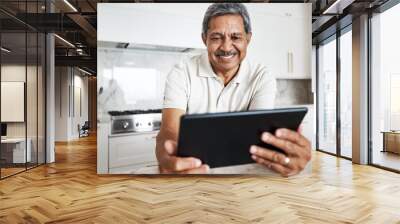 Mature man, tablet and home on social media, internet and reading online news application. Happy grandpa, digital technology and connection in house for networking, website search and ebook for smile Wall mural