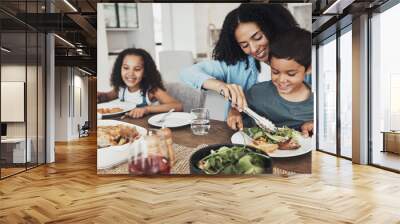 Mom, children and eating food in home together for lunch, dinner table and healthy meal. Happy family, mother and kids smile for dining in house with love, care and happiness of delicious supper Wall mural