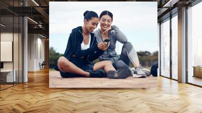 Relax, phone and fitness friends on social media app for chill break together after training. Happy girl friendship internet news, funny meme post and internet entertainment for workout rest outdoor Wall mural