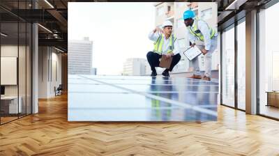 Solar energy, sustainability and engineer team on a rooftop to repair, program or install renewable power in a city. Sustainable, man and teamwork by technician for eco friendly electricity Wall mural