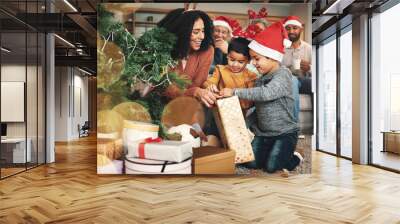 Christmas, family and boys opening a gift, celebrating a holiday and happy with a box. Smile, giving and excited children starting to open a present from their mother during festive season together Wall mural