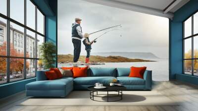 Lake, nature and grandfather fishing with a child learning on an adventure, holiday or weekend trip. Hobby, outdoor and elderly man teaching kid to catch fish on a vacation by a river with mockup Wall mural