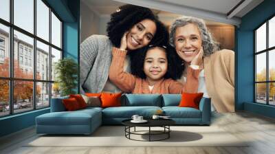 Love, family and portrait by girl with mother and grandmother on a sofa, happy and smile in their home. Bond, relax and face of senior woman with adult daughter and grandchild on couch on the weekend Wall mural