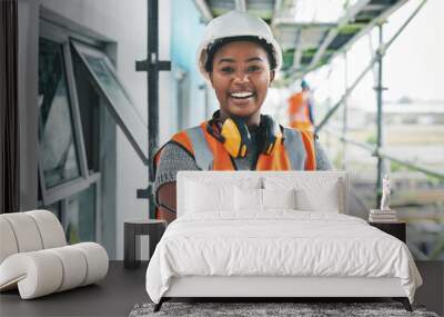 Youll want to invest in this new development. Portrait of a young woman working at a construction site. Wall mural