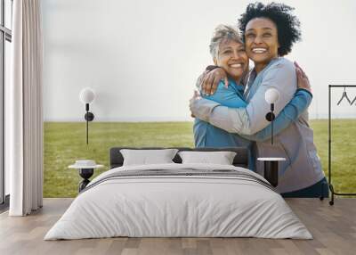 Happy, hug and portrait of senior women bonding with love, care and friendship after a workout together. Happiness, nature and elderly female friends with a smile in sportswear after training in park Wall mural