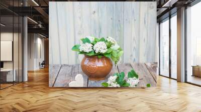 Vintage floral background. Aronia Flowers. Chokeberries flower on wooden table Wall mural