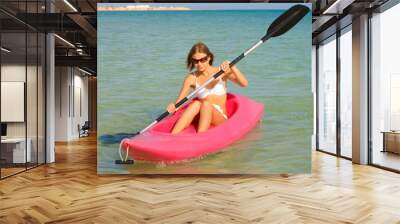 Girl in bikini sailing a kayak Wall mural