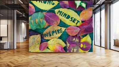 Creative colorful autumn concept for self motivation and positive attitude with words carved into leaves. Flat lay. Wall mural