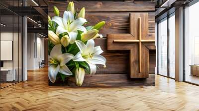 A closeup of a wooden cross dd with pale lilies, evoking feelings of peace and joy in celebration of Jesus triumph over death. Wall mural