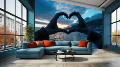 Hands In Shape Of Heart. Silhouette of Hands Forming Heart Gesture with Romantic Sky Background Wall mural