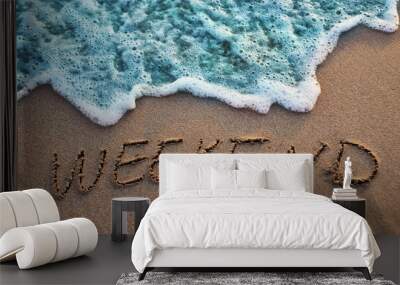 The word weekend written on sand. Sunset beach. Summer background. Wall mural