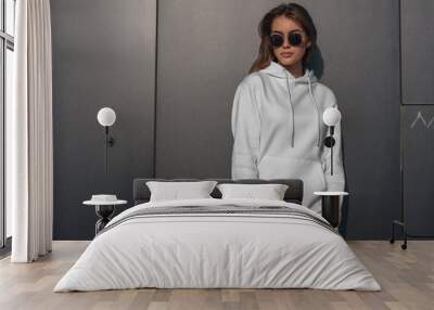 Women white hoodie mockup with model wall background Wall mural