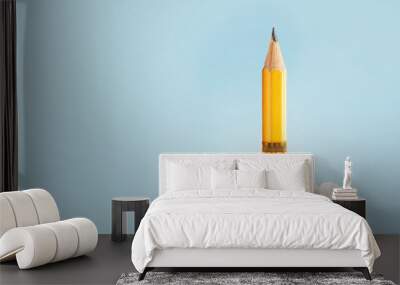 Creative yellow pencil successfully takes off with smoke and blast on a blue background, creative idea. Start-up and development, concept. Back to school. Grow and brainstorm Wall mural