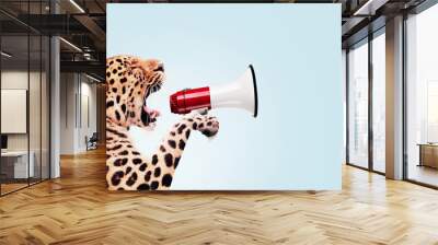 Leopard holding a loudspeaker and screaming, creative idea. Successful attracting attention and traffic, concept. Business and manage. Boss wild animal Wall mural