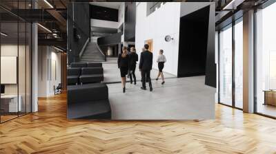 Business people walking in office lobby Wall mural