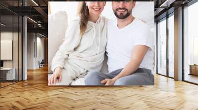 Couple relaxing in living room Wall mural