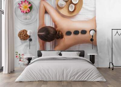 Woman getting spa hot stones massage Wall mural