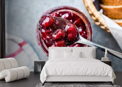 Cranberry Jam in Jar with Spoon / Cranberries Marmalade served with Bread Slices in Wicker Bowl. Wall mural