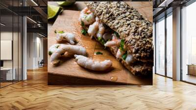 Shrimp Sandwich with lime on wooden surface. Wall mural