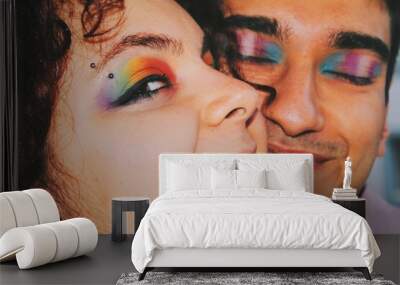 happy smiling portrait of two lgbtq gender queer friends with rainbow pride flag and trans pride flag eye makeup with eyebrow piercing Wall mural