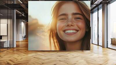 Young and cheerful model looking at camera outdoors on blurred background Wall mural