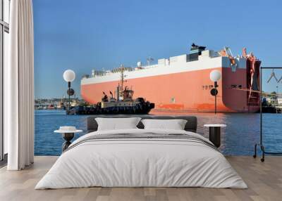 cargo ship and tug boat in harbour Wall mural