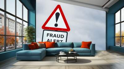 Fraud alert ahead triangular road sign agaist storm sky Wall mural